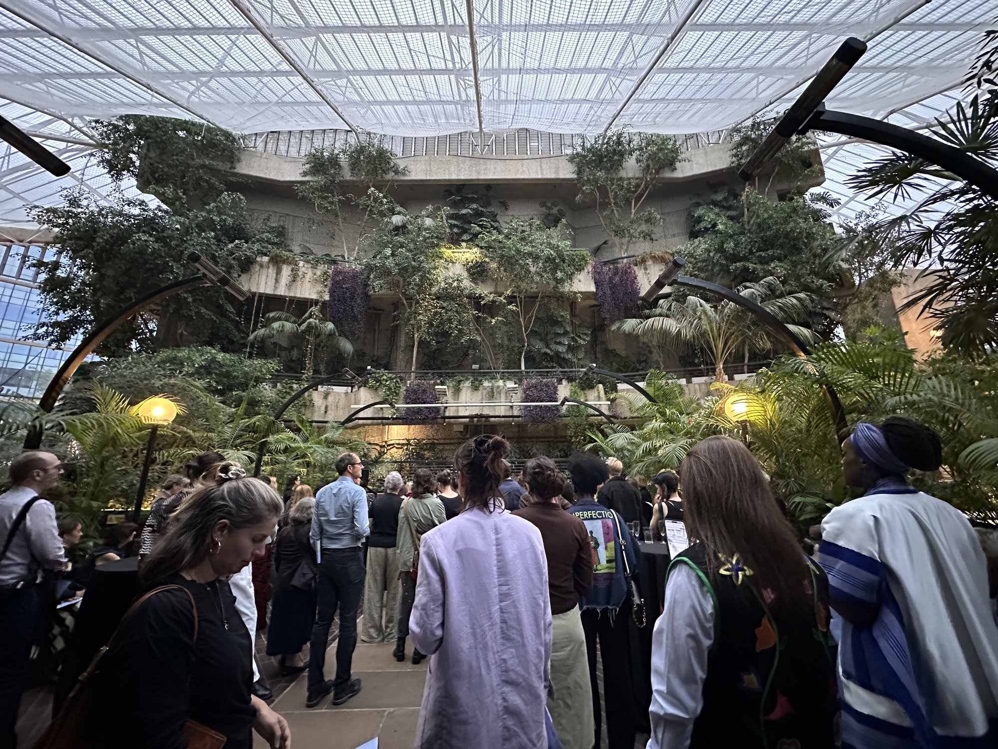 Guests gathering in the Barbican Conservatory