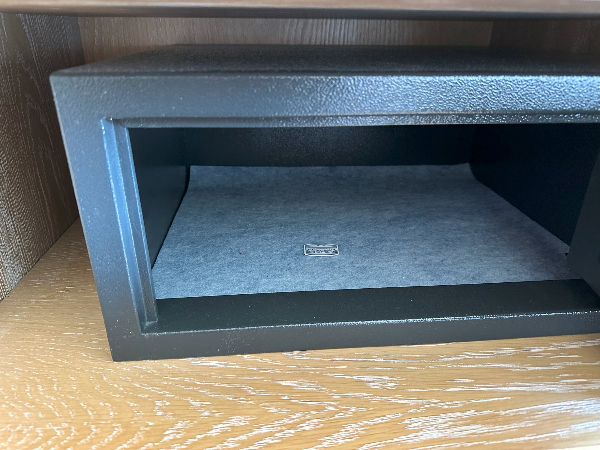 A small heuristic sticker left inside an open hotel safe