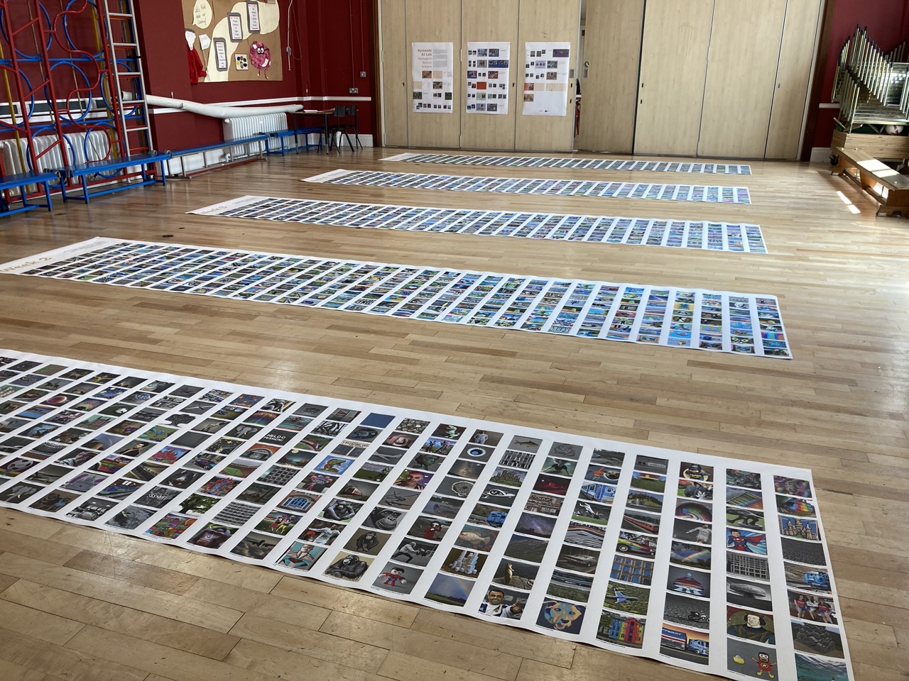 Overview of the exhibition setup. The long prints on the floor show the students' weekly progress and outputs.